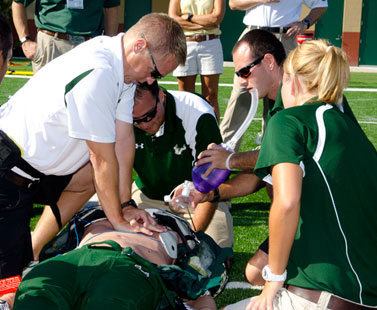 Unconscious Athlete Getting CPR by his Coach